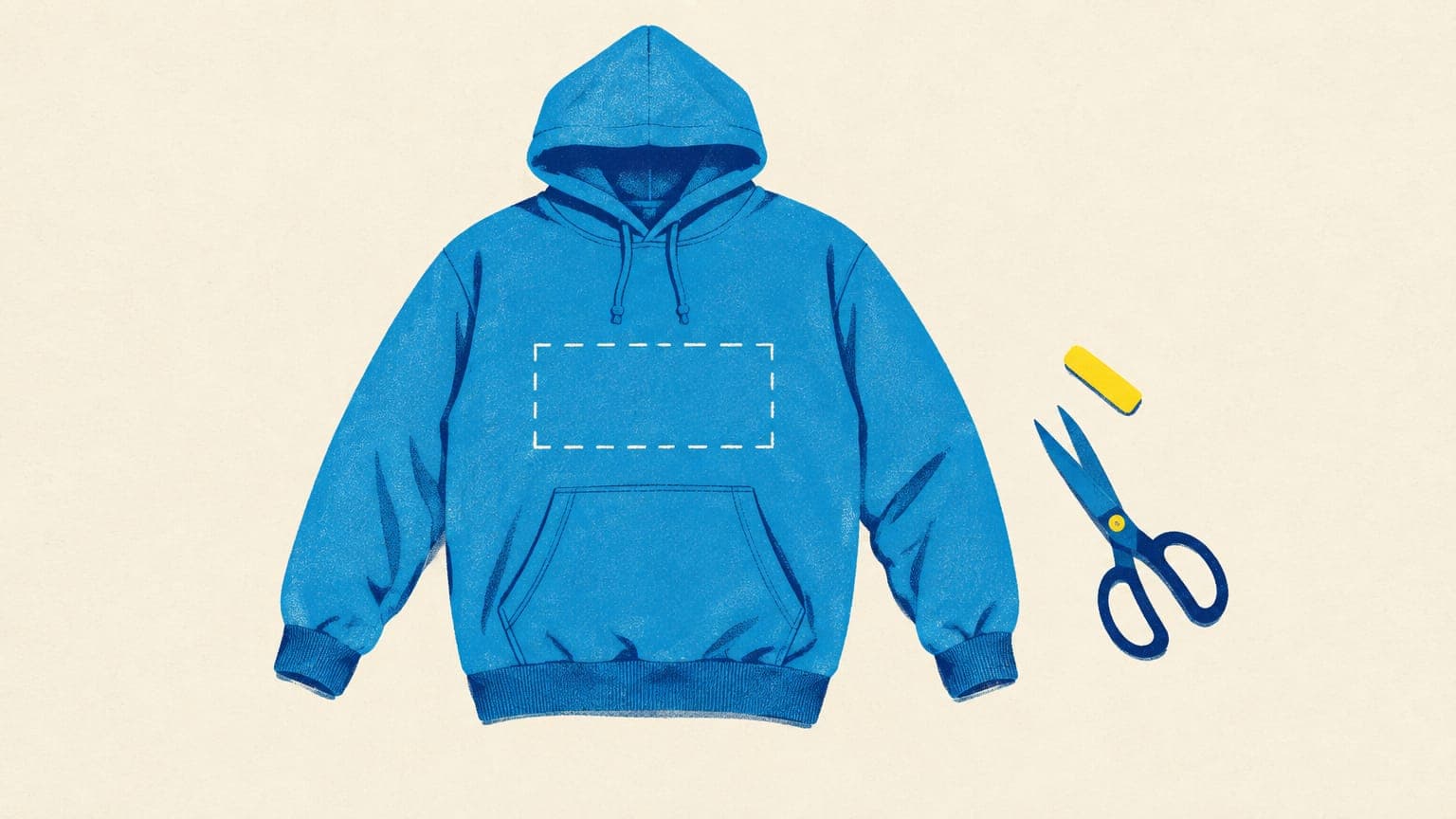 Flat hoodie with a chalk rectangle marked on the chest above the pocket, with tailor's chalk and scissors beside it